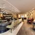 Savoy Boutique Hotel by TallinnHotels bar and lounge with long counter, stools, and warm lighting in Tallinn