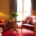 Landhaus Zu den Rothen Forellen in Ilsenburg: elegant room with two armchairs, lamp, and round table by the window