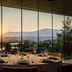 Exe Las Margas Golf Hotel in Latas dining room with panoramic sunset mountain and golf course views