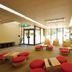 Hakonenomori Okada in Hakone lobby lounge with red floor cushions and seating by large windows