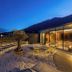 Alter Schlachthof in Bressanone/Brixen rooftop terrace with lounge chairs and mountain views at dusk
