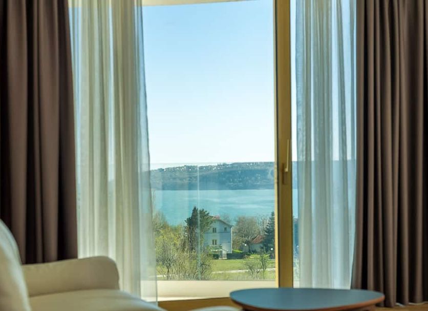 Amiral Hotel in Varna guest room with window view of the sea and shoreline