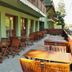 Hotel Hajnal in Mezőkövesd with outdoor terrace seating and mountain views