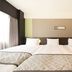 Richmond Hotel Higashi Osaka room with three beds, large window, and neutral-toned headboard in Higashiosaka