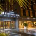 Extenso Hotel in Izmir exterior at night with illuminated entrance and palm trees
