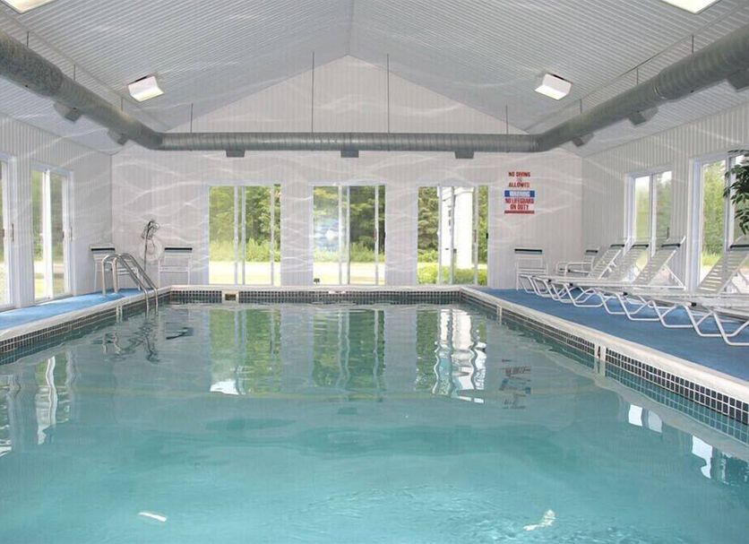 Mackinaw Budget Inn in Mackinaw City indoor pool with lounge chairs and large windows