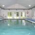 Mackinaw Budget Inn in Mackinaw City indoor pool with lounge chairs and large windows