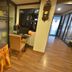 The Heritage Sathorn Suite Hotel Bangkok lobby with reception desk, flowers, and wood flooring