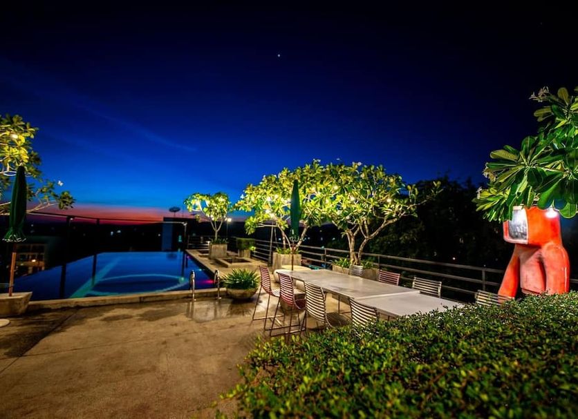 The B Ranong Trend Hotel in Mueang Ranong rooftop pool and terrace at night