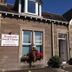 Rosebank Guest House in Perth, stone guest house exterior with flower baskets and bay windows