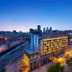 Puruihotel Yongkang in Jinhua, city skyline view with illuminated modern hotel exterior at dusk