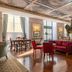 Pousada de Lisboa in Lisbon, elegant lounge with red sofas, polished wood floors and ornate ceiling
