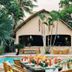Hibiscus Garden Resort in Puerto Princesa with tropical garden pool and thatched-roof lounge