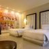 In Fashion Hotel & Spa, Playa del Carmen guest room with two beds and abstract wall art