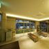 Business Hotel Cuore Tsuruga lobby with benches, large windows and evening lighting