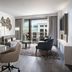 The Westin Anaheim Resort in Anaheim suite with living area, dining table and balcony city view