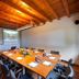 Meeting room at Hotel-Apartamento Rural Atxurra in Bermeo with wood-beamed ceiling and conference table