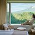 Hakodate-Onuma Prince Hotel in Nanae room with picture window framing mountain and forest views