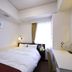 Hotel Shimbashi Sambankan Tokyo guest room with double bed and desk by a window