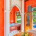 DPNY Beach Hotel in Ilhabela with open doors to a pool and ocean view from a colorful suite