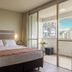 Castelmar Hotel Florianopolis guest room with king bed and balcony city view
