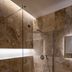 Relais Villa Grazianella Una Esperienze bathroom with marble-tile walk-in shower in Acquaviva