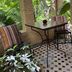 Riad Jardin Des Biehn, Fez: shaded patio seating with arched stone openings and lush garden views