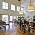 Hampton Inn & Suites Charleston/West Ashley breakfast area with tall ceilings, hanging lights and high tables in Charleston