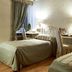 Hotel Parco Borromeo in Cesano Maderno guest room with twin beds, desk, and window drapes