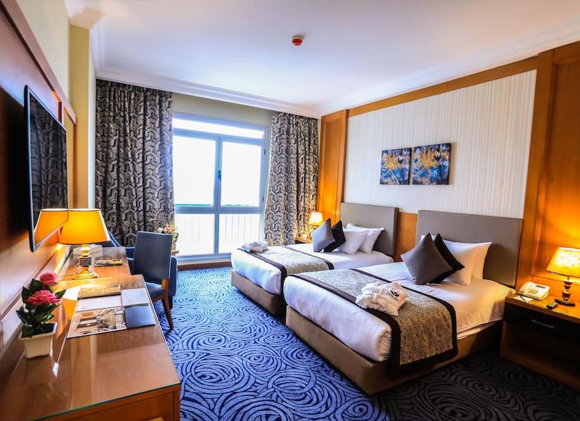 Tolip El Forsan Hotel in Ismailiyah guest room with twin beds and balcony window