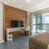 Fusion Hplus Express + Brasília room with balcony and city view, TV, desk, and bed