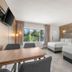 The Garden Hotel & Resort Fort Lauderdale guest room with two beds and tropical window view