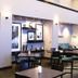 Hampton Inn and Suites Suisun City Waterfront bar area with high-top tables and stools in Suisun City