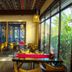 Secret Courtyard Resort Hotel Guilin dining area with colorful decor and garden-facing windows