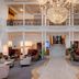 Grand Hotel Des Bains Kempinski, St. Moritz: grand lobby with chandelier and central staircase