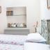 Alla Torre Del Barbarossa B&B Foresteria bedroom with twin beds and window in Mandello del Lario