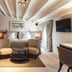 Sant Francesc Hotel Singular Palma de Mallorca suite with king bed, seating area, desk and wall-mounted TV