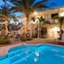Hotel Cabana Clearwater Beach in Clearwater Beach with a lit palm-lined pool courtyard and outdoor seating