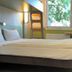 ibis budget Köln Leverkusen City room with bunk bed, desk, wall TV and window in Leverkusen