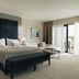 La Réserve Resort, Knokke Heist: bright hotel suite with king bed, sitting area and balcony doors