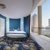 Xiamen Harbor Bay Hotel (Zhongshan Road First Wharf Store) in Xiamen, room with curved window and city view