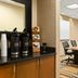 Fairfield Inn and Suites by Marriott Weirton conference room with table, chairs and coffee station
