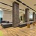 Melia Ibirapuera lobby in Sao Paulo with lounge seating, mirrored accents and wood flooring