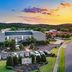 The Burgundy Hotel, Little Rock exterior at sunset with parking lot and landscaped grounds