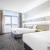 Nightcap at Sandringham Hotel Melbourne room with two beds, desk, TV and balcony door
