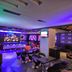 Hotel Vijay Parkinn, Gandhipuram, Coimbatore lounge with colorful neon lighting and bar seating