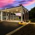 Red Roof Inn & Conference Center Chicago - Aurora Fox Valley exterior at dusk with arched colonnade