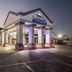 Baymont by Wyndham Port Arthur/Groves Area hotel entrance at dusk in Port Arthur