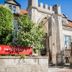 Arensburg Boutique Hotel & Spa in Kuressaare, stone facade with red-tiled roof and arched entrance