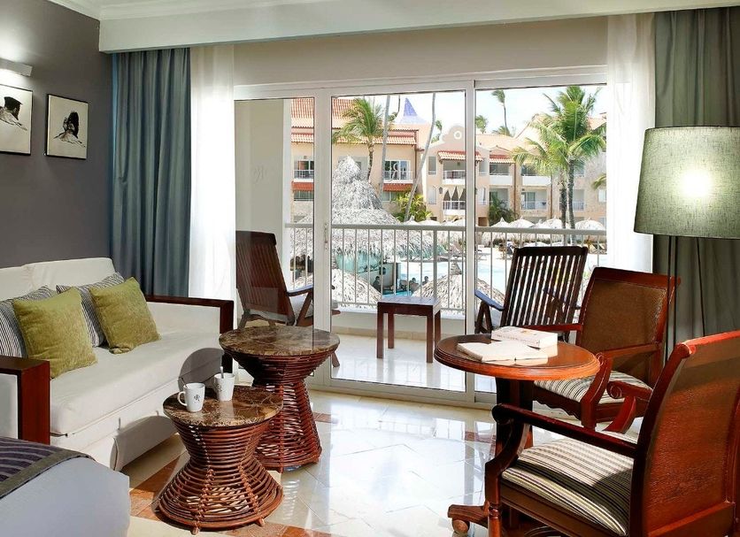 TRS Turquesa by Palladium Punta Cana guest room with balcony view and seating area